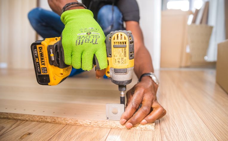 Man installing hardwood flooring